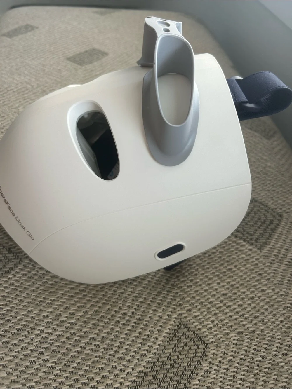 Therabody LED Facial Mask in White with Gray Accents and Navy Strap